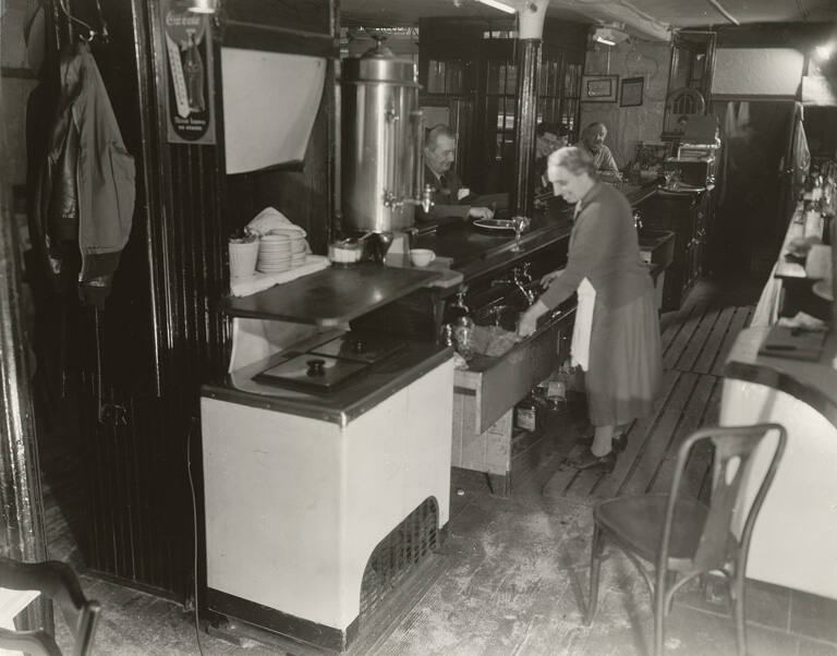 [Woman behind counter in a diner]