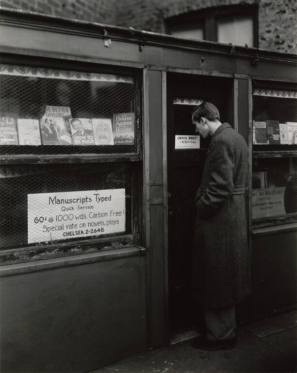 [Man in front of bookstore, Seventh Avenue South]