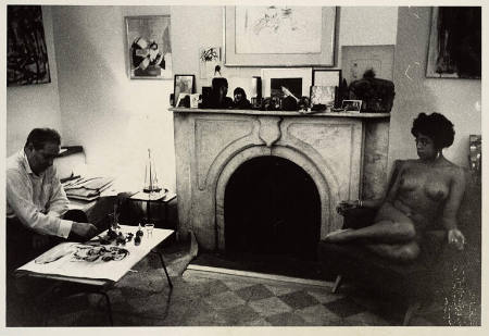 [Woman posing in Walter Gutman’s apartment, New York City]