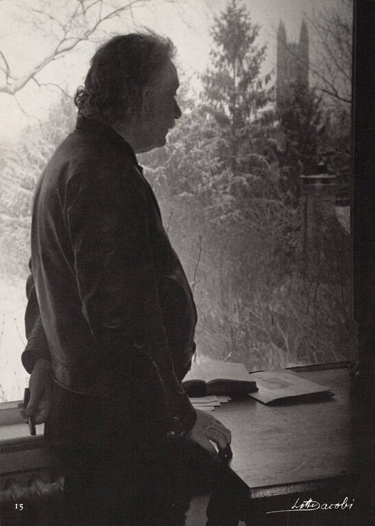 Albert Einstein by window, Princeton Tower in background, from Einstein Portfolio