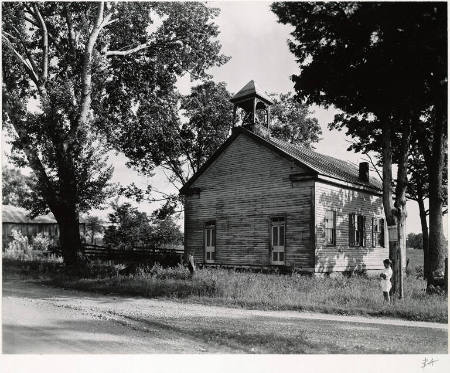 [Child and schoolhouse, near Greenland, Ohio]