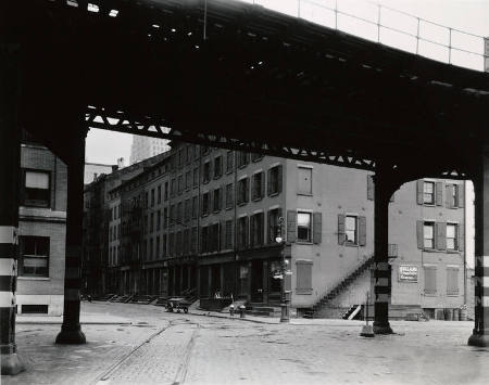 [Elevated train tracks and commercial row]