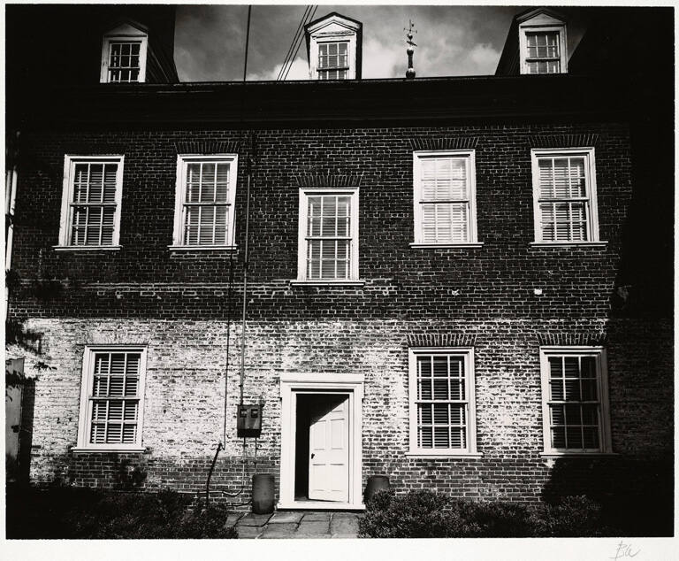 [Façade of two-story brick house]