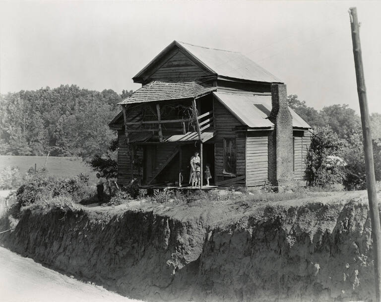 [House with leaning porch]