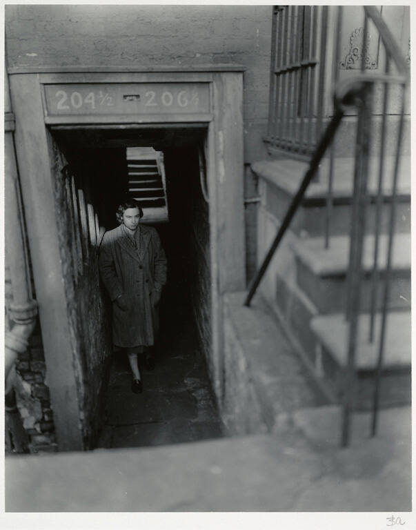[Woman in doorway]