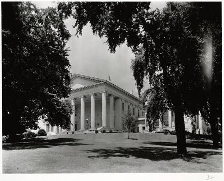 [Neoclassical building seen through trees]