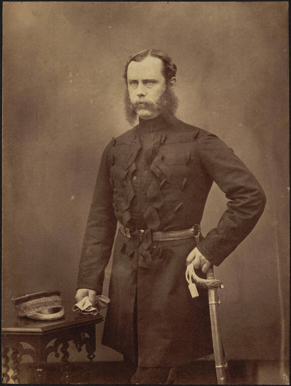 [Man in uniform holding sword]