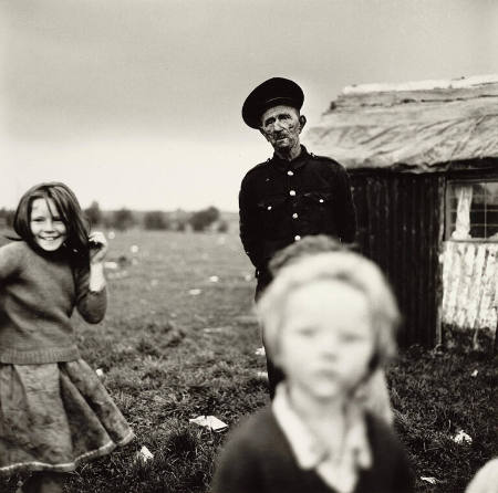 Chimney sweep and children, Ireland, from the portfolio Alen MacWeeney