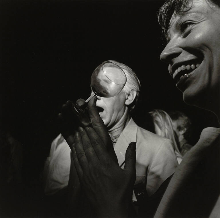 Glass over face—France, July 1988, from the portfolio Social Context