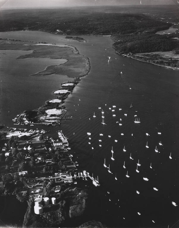 [Aerial of the mouth of Connecticut River with boats from the Essex Yacht Club dotting the water]