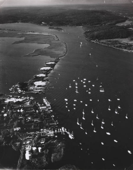 [Aerial of the mouth of Connecticut River with boats from the Essex Yacht Club dotting the water]