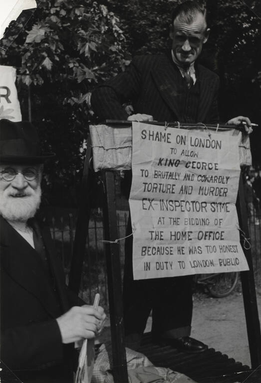 Man in Hyde Park, London, with protest banner
