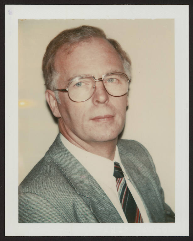 Unidentified man (wearing glasses)