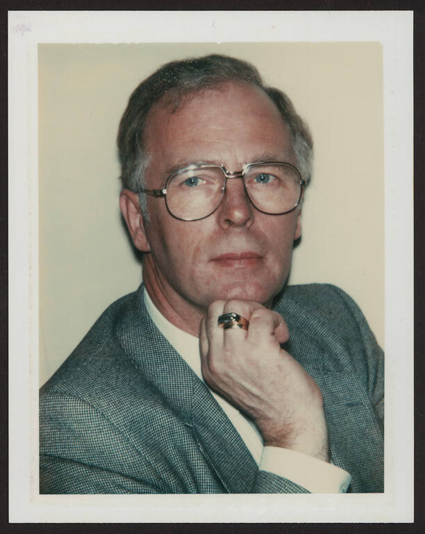 Unidentified man (wearing glasses)
