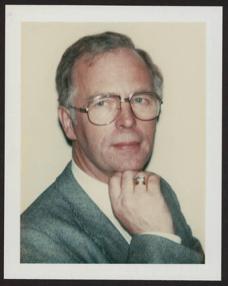 Unidentified man (wearing glasses)