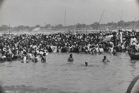 Crowds attending Gandhi's funeral standing in the sacred river Jumna, New Delhi, India