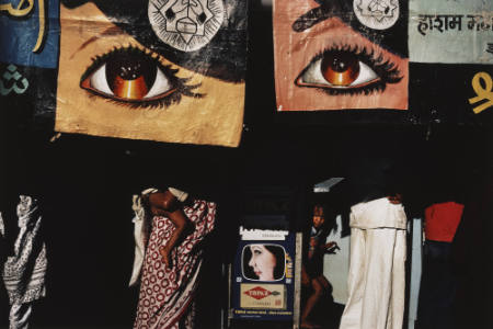 Marketplace or bazaar with painted banners of women's eyes