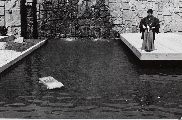 World's Fair, NYC (Man looking at car in pool), from the portfolio Joel Meyerowitz Photographs, The Early Works