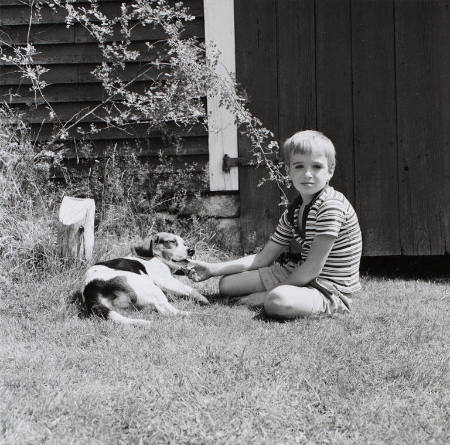 Young boy with beagle, Cranberry Island, Maine