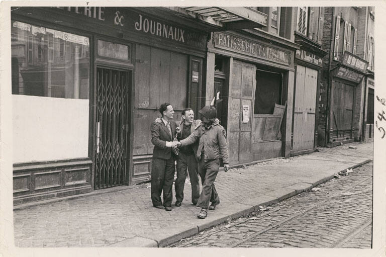 [Cheering Frenchmen stopping American soldier to shake his hand]