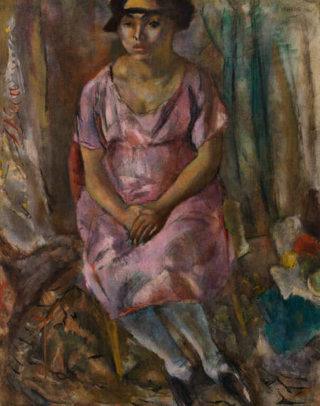 Seated woman in a pink dress