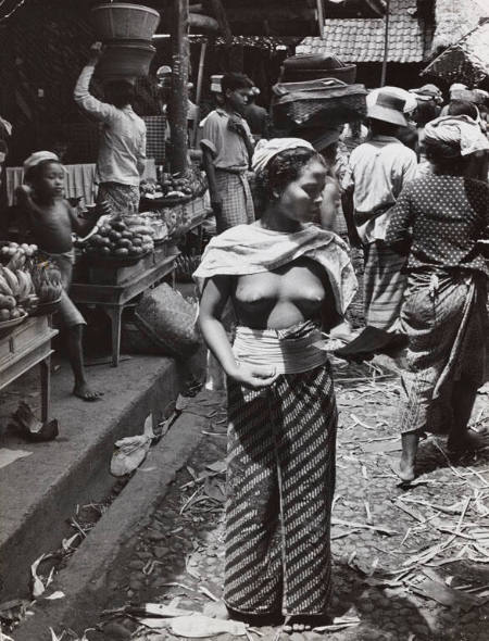 Young woman standing in a market, Bali