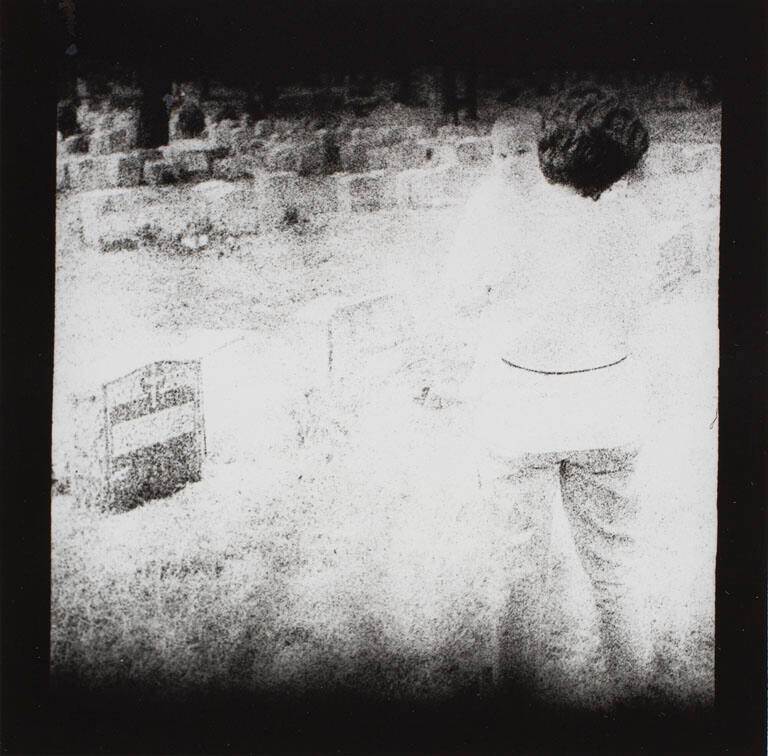 Mother and child {Maria and Adriana] in graveyard, New York City