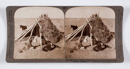 At breakfast—typical desert home of Navajo Indians (S.W.), Arizona