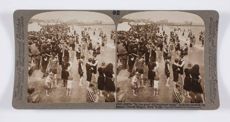 "In the good old summer time," holiday crowds on beach, Coney Island, New York