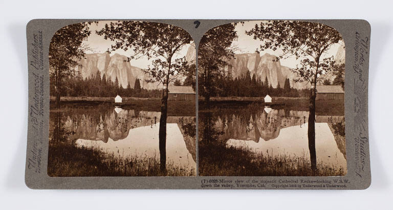 Mirror view of the majestic Cathedral Rocks—looking W.S.W. down the valley, Yosemite, Cal.