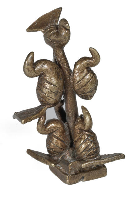 Goldweight in the form of seven birds on a column