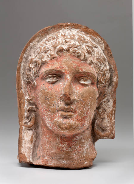 Head with curly hair (semi-relief)
