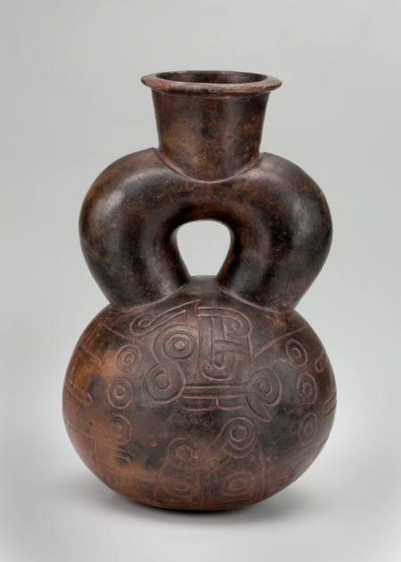 Stirrup-spout vessel with incised feline raptor