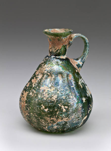 Green ribbed pitcher with applied handle