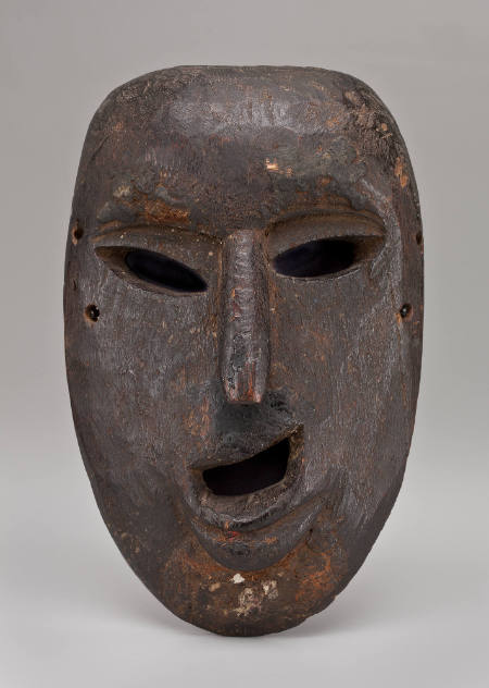 Mask of human face, mouth open, long, slender nose