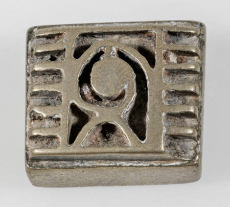 Rectangular goldweight with central coil motif, semi-circle and two borders of repeated lines