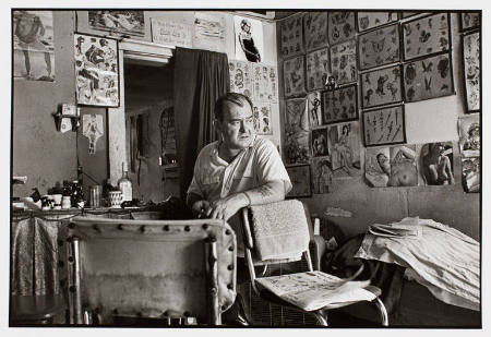 Bill Sanders in his tattoo shop, Washington Street, Houston