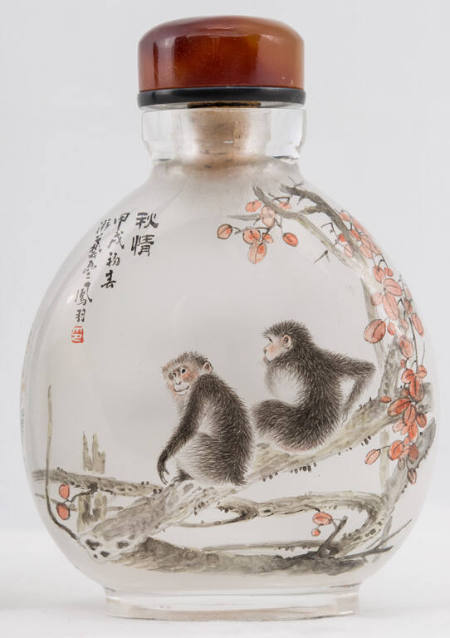 Snuff bottle with design of monkeys on a pine tree