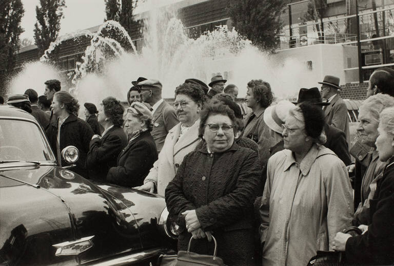 Fair-goers wait by fountain, Brussels World Fair