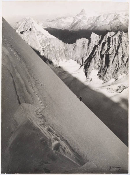 A climber ascending the north east face of Les Droites, Chamonix