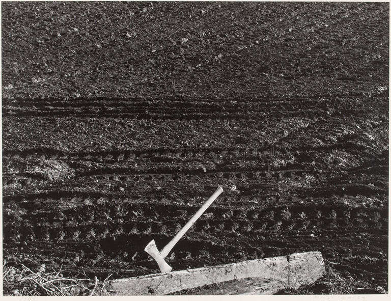 Axe and ploughed field